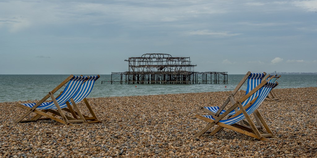Two Beach Chairs facing Out to Sea on Brighton Beach
